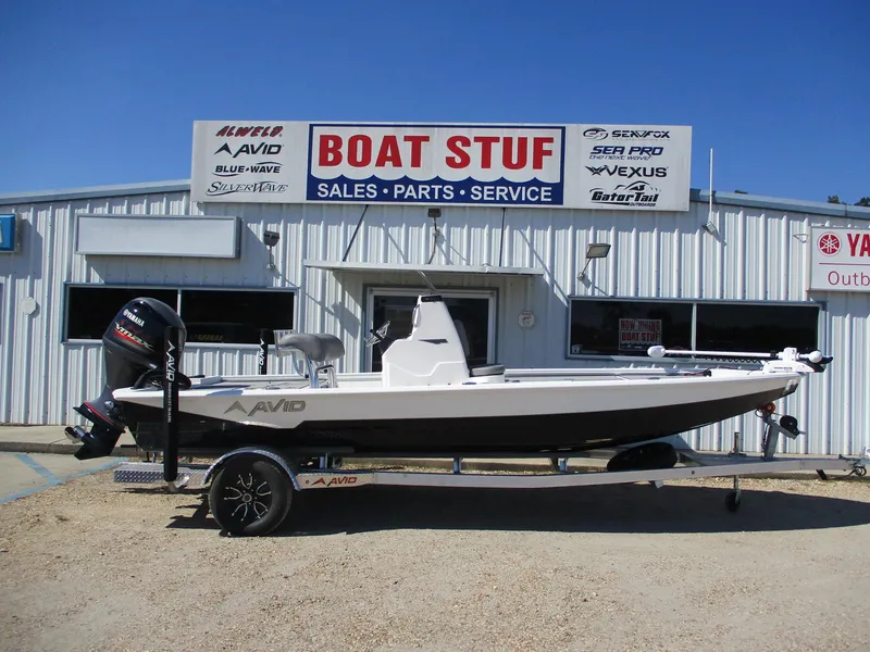 The Image of 2025 Avid 21 FSX boat on trailer outside dealership. - 0