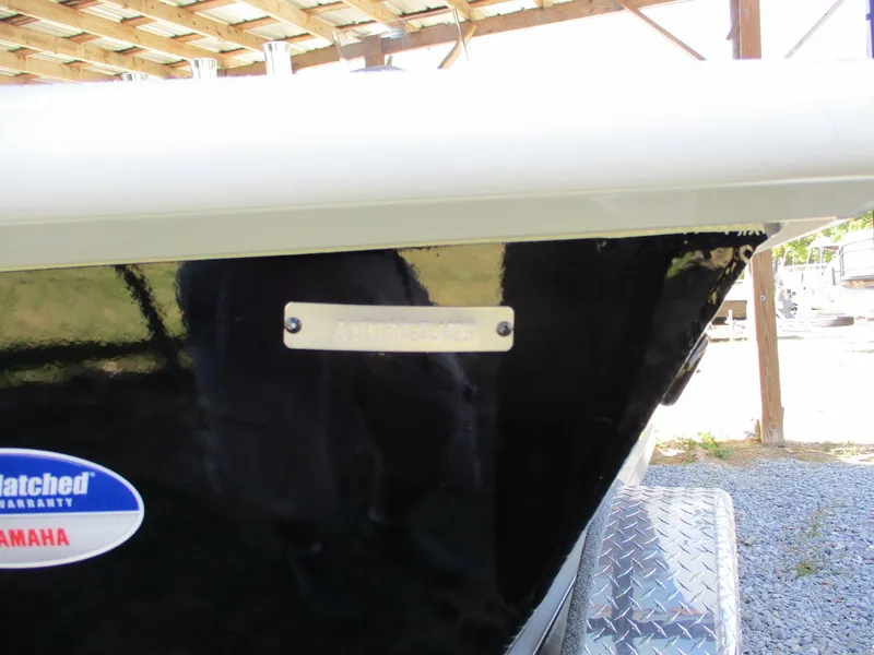 Slide: The Image of Close-up of 2025 Avid 21 FSX boat hull with Yamaha warranty sticker. - 12