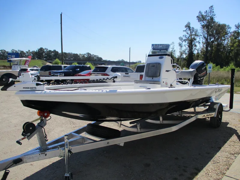 Slide: The Image of 2025 Avid 21 FSX boat on trailer in outdoor setting. - 3