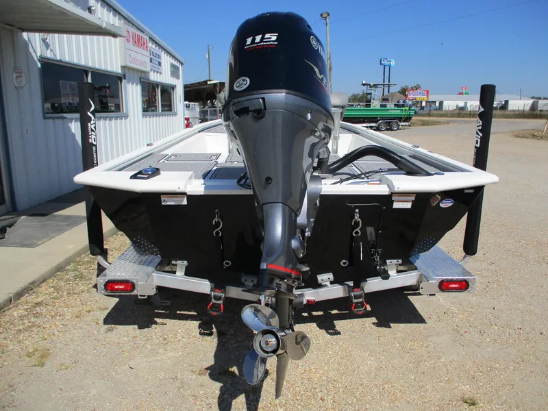 Slide: The Image of 2025 Avid 21 FSX boat with outboard motor, parked on a trailer. - 6