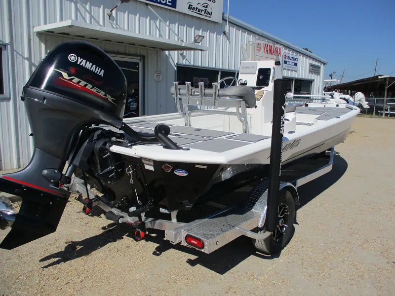 Slide: The Image of 2025 Avid 21 FSX boat with Yamaha outboard motor on trailer. - 7