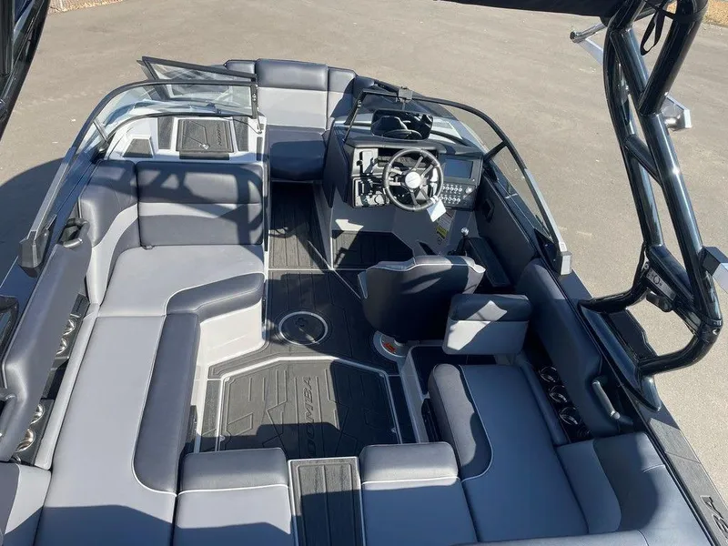 Slide: The Image of 2025 Moomba Mondo boat interior with sleek seating and modern dashboard design. - 14