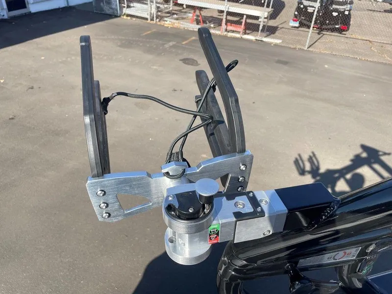 Slide: The Image of 2025 Moomba Mondo boat accessory, featuring a metal and plastic mount on a sunny day. - 21