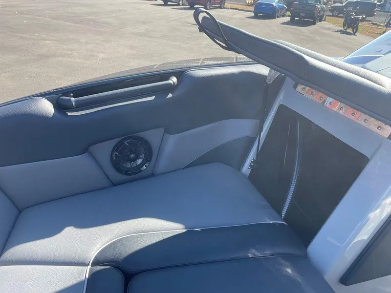 Slide: The Image of 2025 Moomba Mondo boat interior with speaker and seating detail. - 24