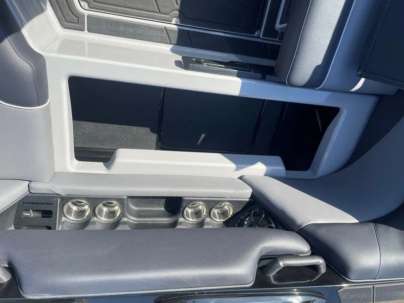 Slide: The Image of 2025 Moomba Mondo interior seating with cup holders and sleek design. - 40