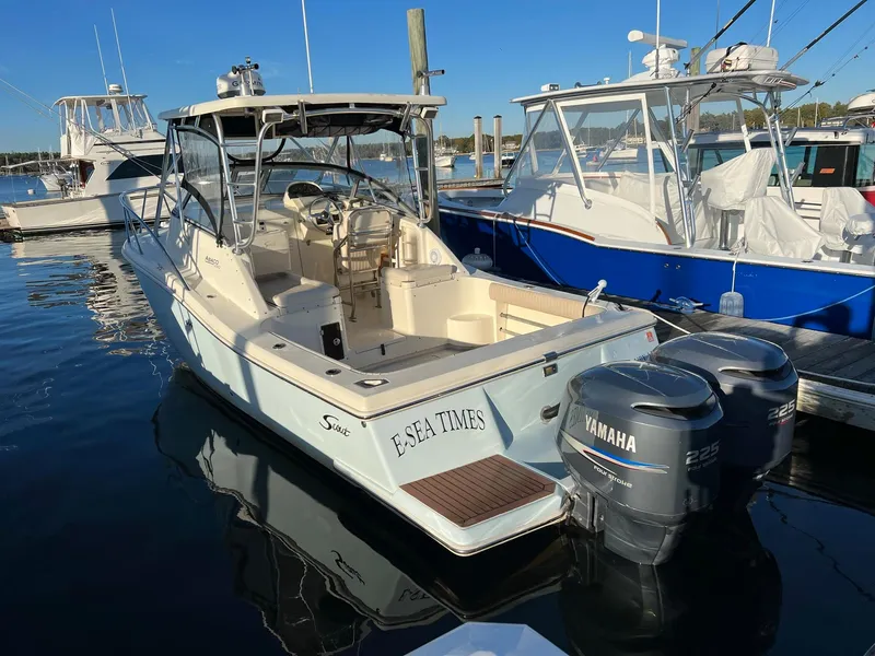 Slide: The Image of 2004 Scout 280 Abaco boat with Yamaha engines docked at marina. - 1