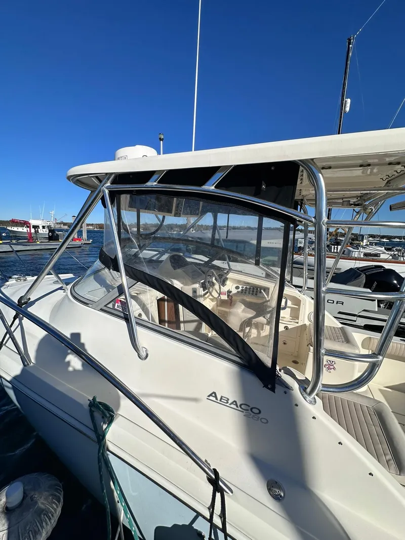 Slide: The Image of 2004 Scout 280 Abaco boat docked at marina under clear blue sky. - 17