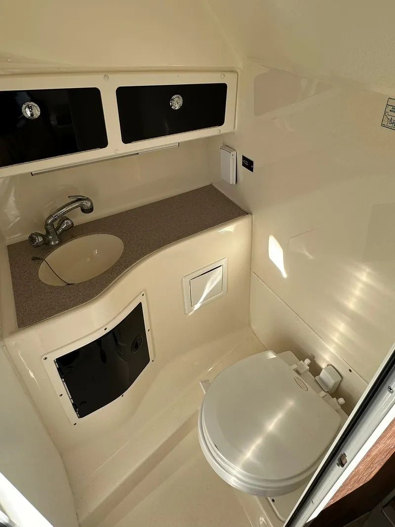 Slide: The Image of 2004 Scout 280 Abaco boat bathroom with sink and toilet. - 19