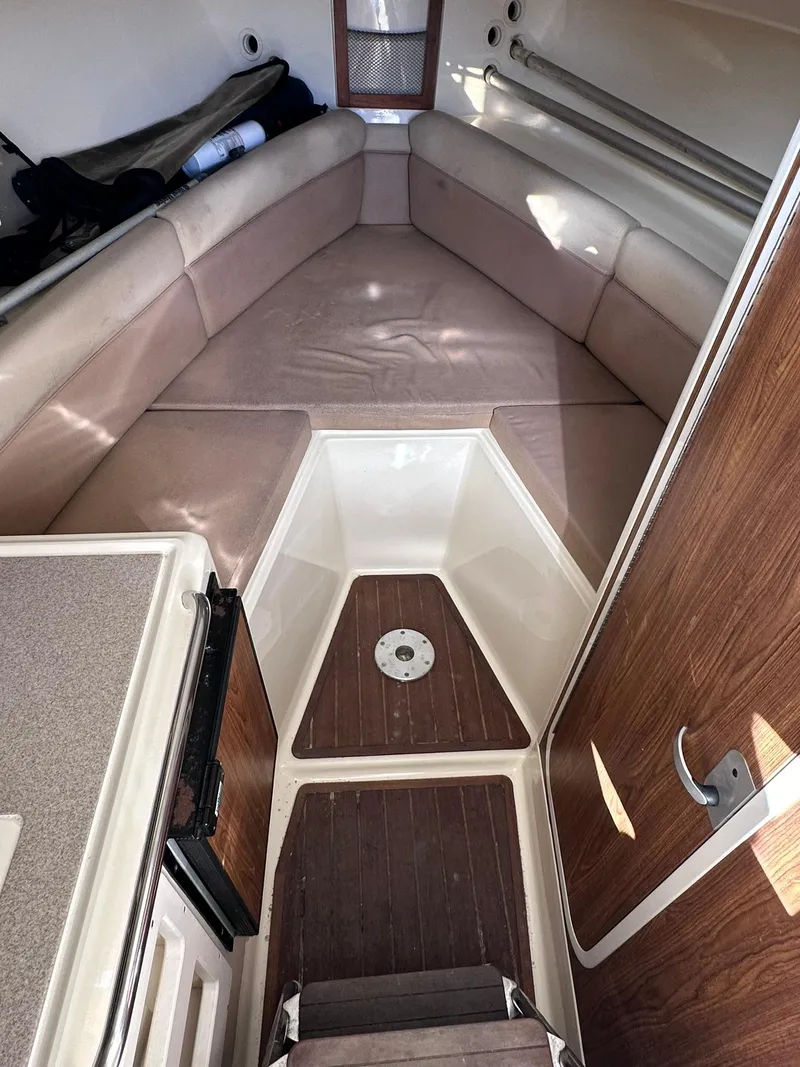Slide: The Image of Interior cabin of 2004 Scout 280 Abaco boat with seating and wood accents. - 20