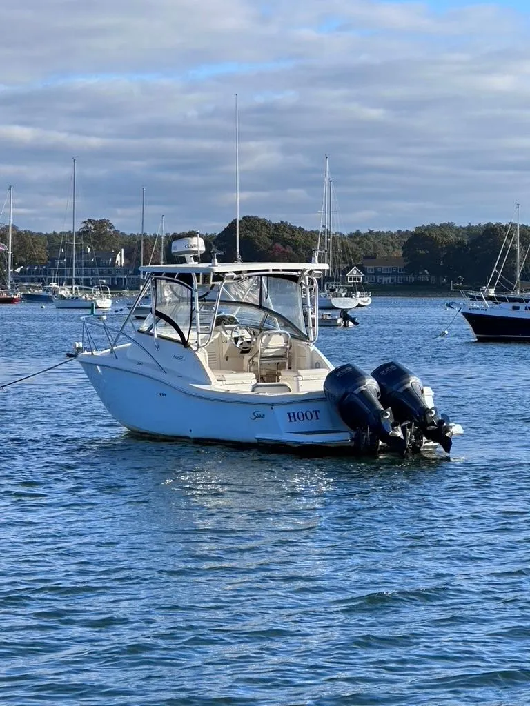 Slide: The Image of 2004 Scout 280 Abaco boat anchored in a scenic harbor. - 7