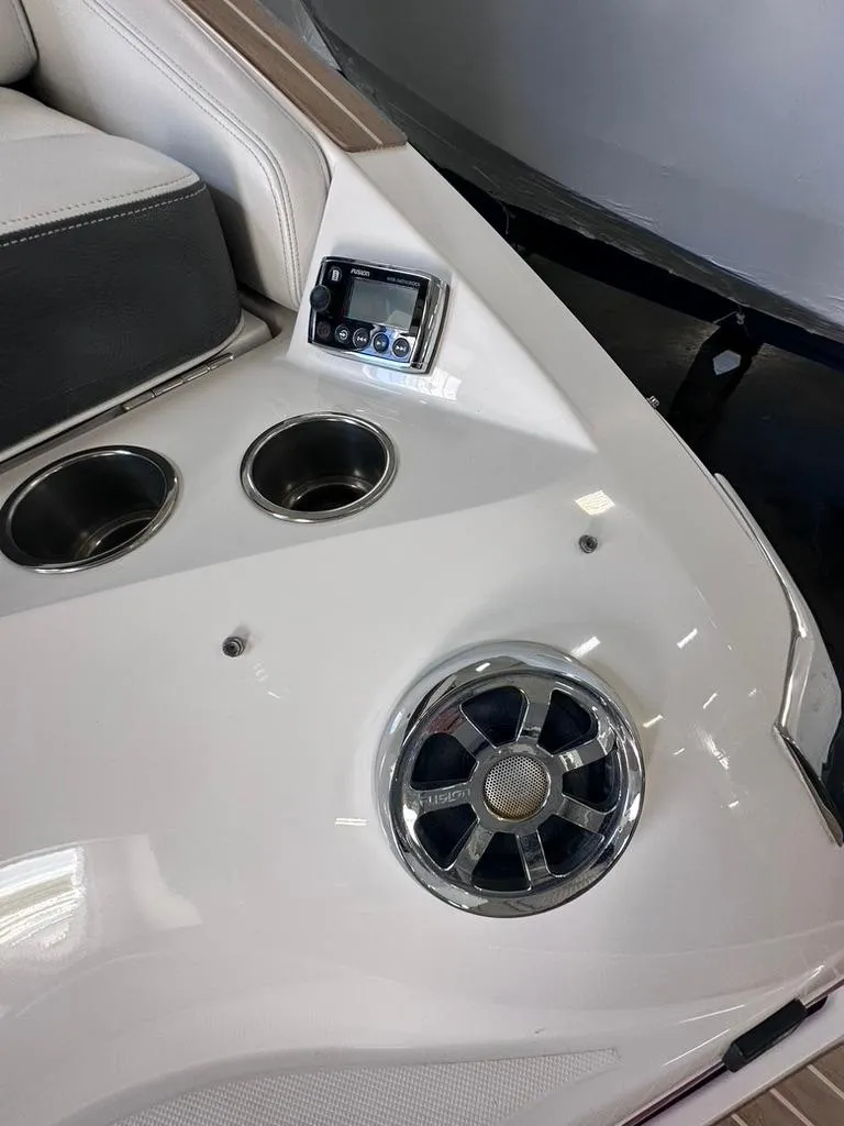 Slide: The Image of 2015 Regal 2800 Bowrider interior with cup holders and speaker system. - 4