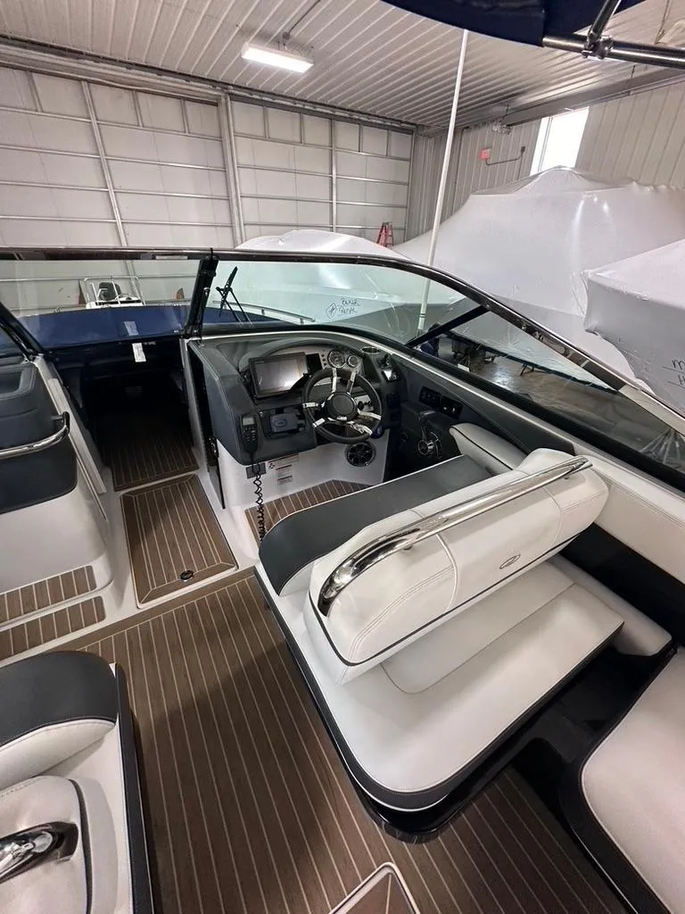 Slide: The Image of 2015 Regal 2800 Bowrider interior with sleek seating and modern dashboard. - 7