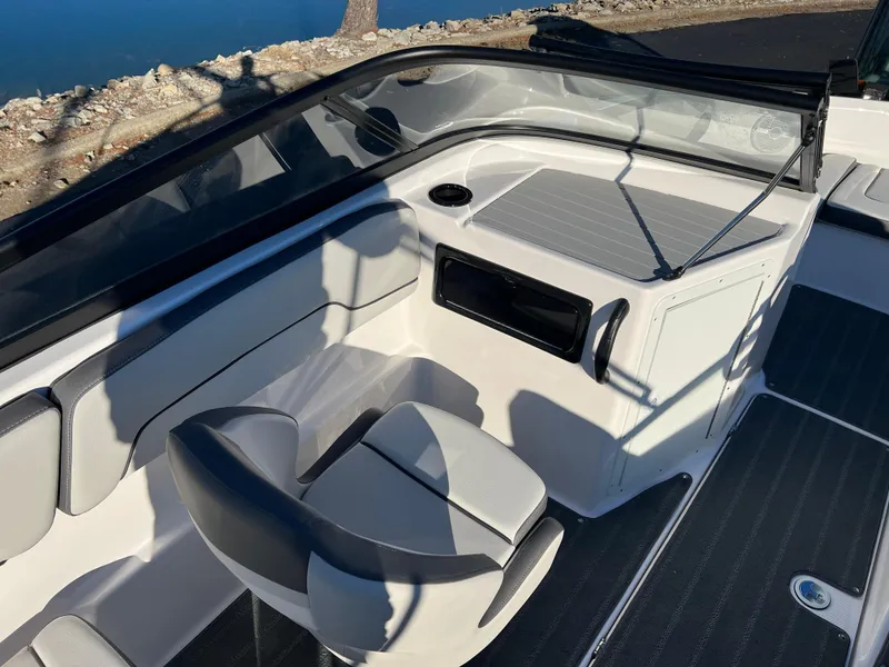 Slide: The Image of 2025 Yamaha Boats SX190 interior with sleek seating and modern dashboard design. - 11