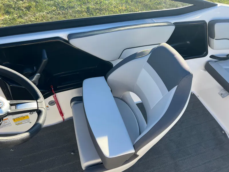 Slide: The Image of 2025 Yamaha Boats SX190 interior with sleek seating and modern steering wheel design. - 19