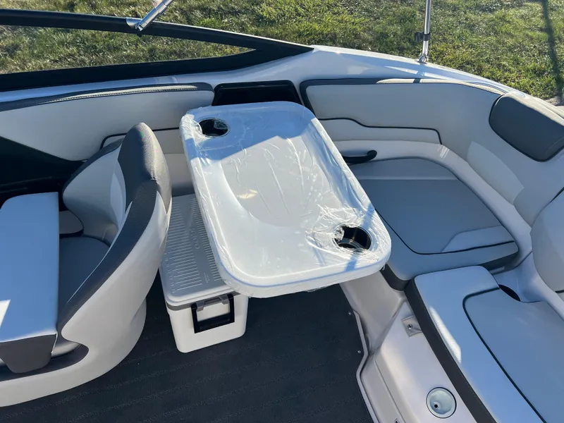Slide: The Image of 2025 Yamaha Boats SX190 interior with seating and table setup. - 20