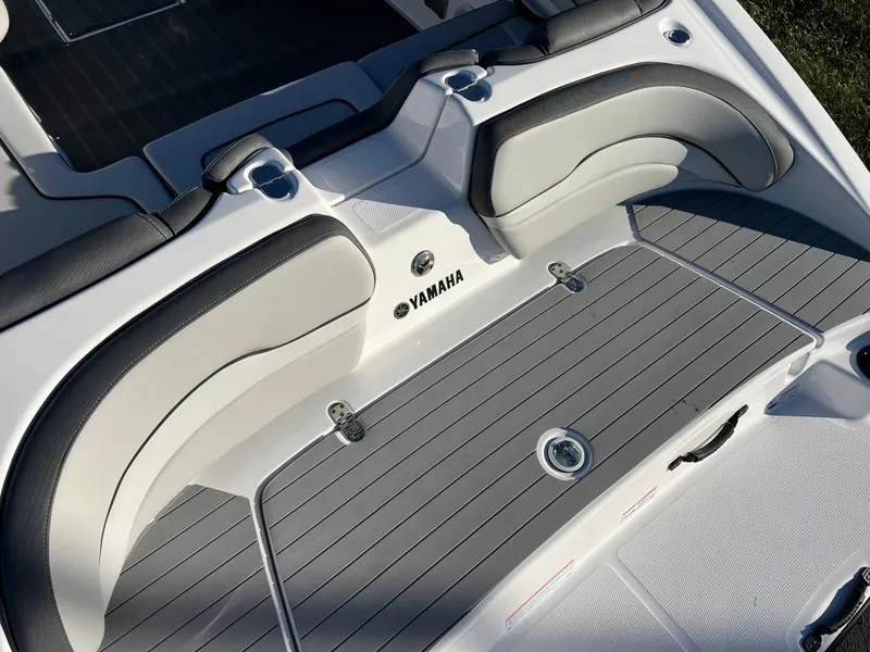 Slide: The Image of 2025 Yamaha SX190 boat interior with gray seating and deck. - 8
