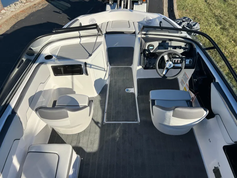 Slide: The Image of 2025 Yamaha Boats SX190 interior with modern seating and steering console. - 10