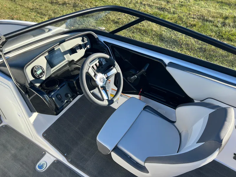 Slide: The Image of 2025 Yamaha Boats SX190 cockpit with steering wheel and dashboard, featuring modern design. - 12