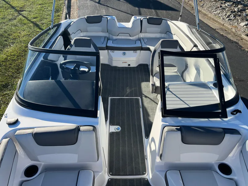 Slide: The Image of 2025 Yamaha Boats SX190 interior, sleek design, spacious seating, modern dashboard, open bow layout. - 16
