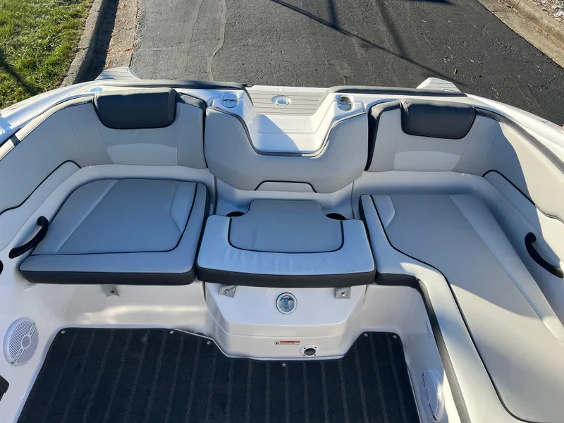 Slide: The Image of 2025 Yamaha Boats SX190 interior with cushioned seating and sleek design. - 18