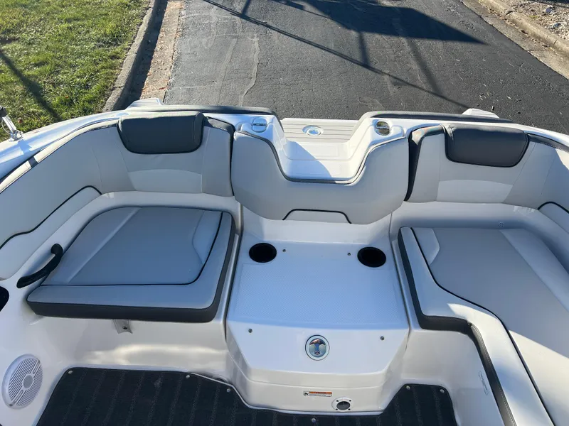 Slide: The Image of 2025 Yamaha SX190 boat interior with seating and cup holders. - 19