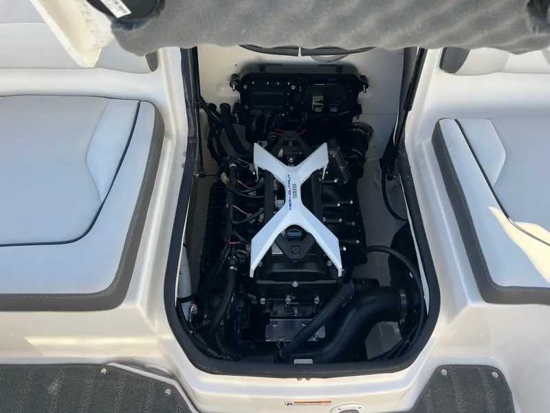 Slide: The Image of 2025 Yamaha SX190 engine compartment with open hatch, showcasing modern design and components. - 21