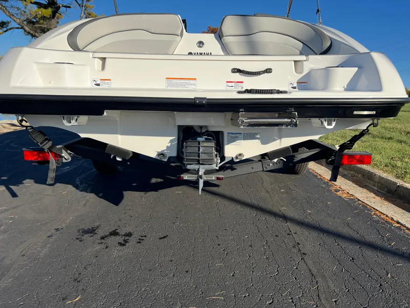 Slide: The Image of 2025 Yamaha Boats SX190 rear view on trailer, showcasing sleek design and dual seating. - 7
