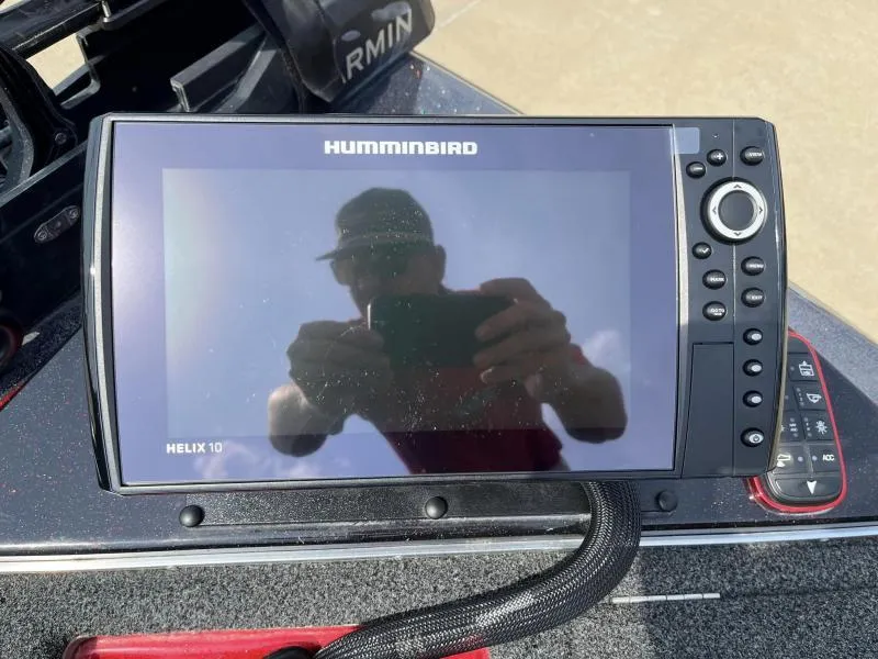Slide: The Image of Humminbird Helix 10 fish finder on a 2018 Legend Trailers V20 boat. - 11