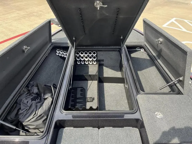 Slide: The Image of Open storage compartments in a 2018 Legend Trailers V20 boat. - 16
