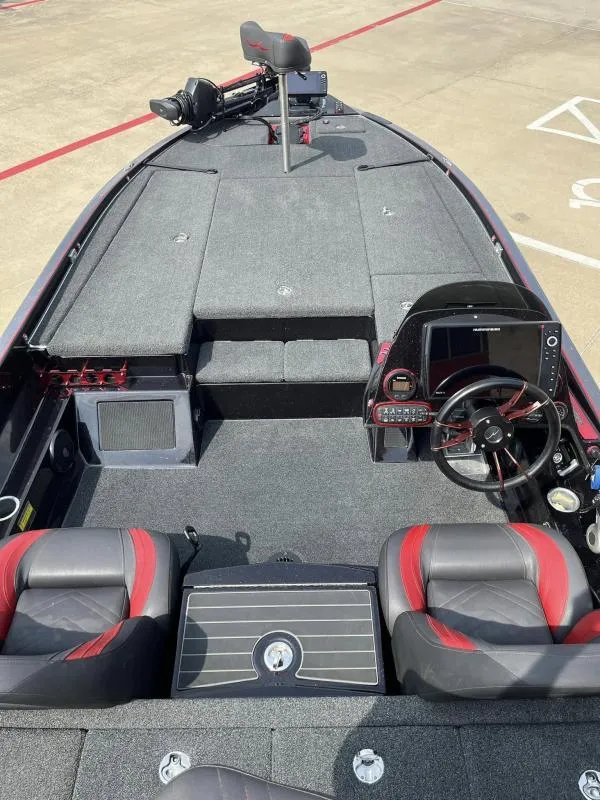 Slide: The Image of 2018 Legend Trailers V20 boat interior with steering wheel and seating. - 9