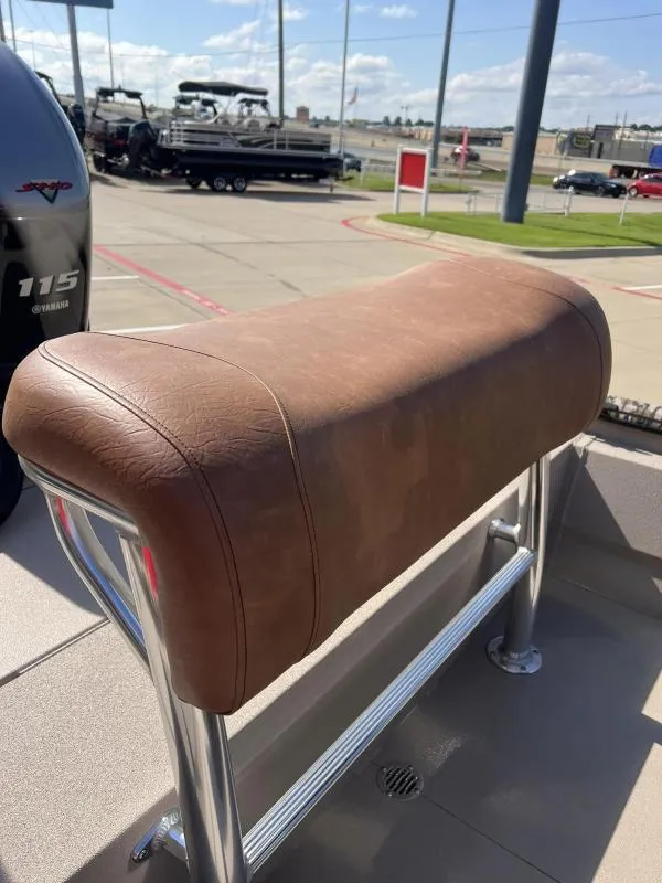 Slide: The Image of Avid 18 Center Console 2025 boat seat with brown leather upholstery. - 12