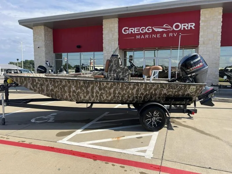 Slide: The Image of 2025 Avid 18 Center Console boat with camouflage design at Gregg Orr Marine & RV. - 2