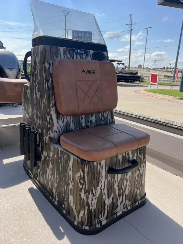 Slide: The Image of 2025 Avid 18 Center Console boat seat with camouflage design and brown cushions. - 9
