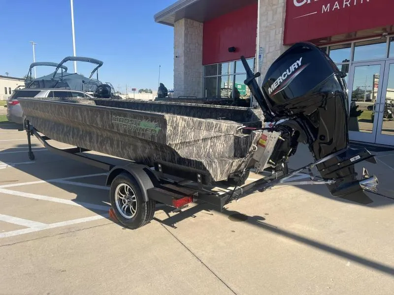 Slide: The Image of 2024 Havoc Boats 1756 MRST with Mercury engine on trailer outside dealership. - 3