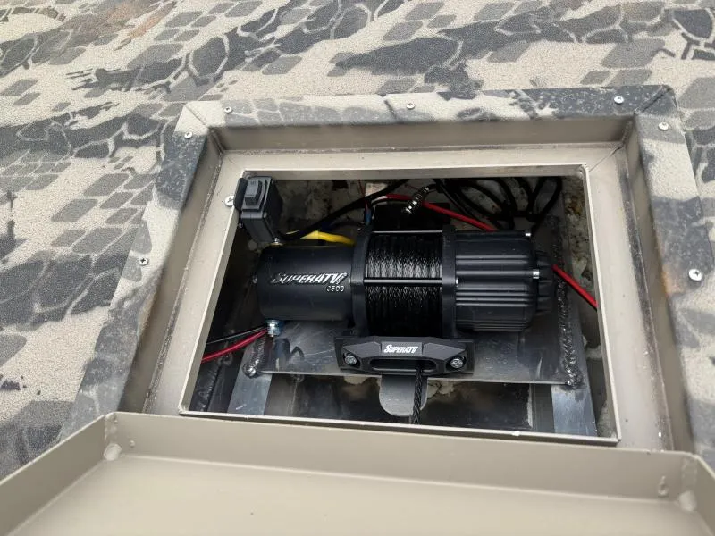 Slide: The Image of 2024 Havoc Boats 1653 MSTC winch compartment with SuperATV winch installed. - 10