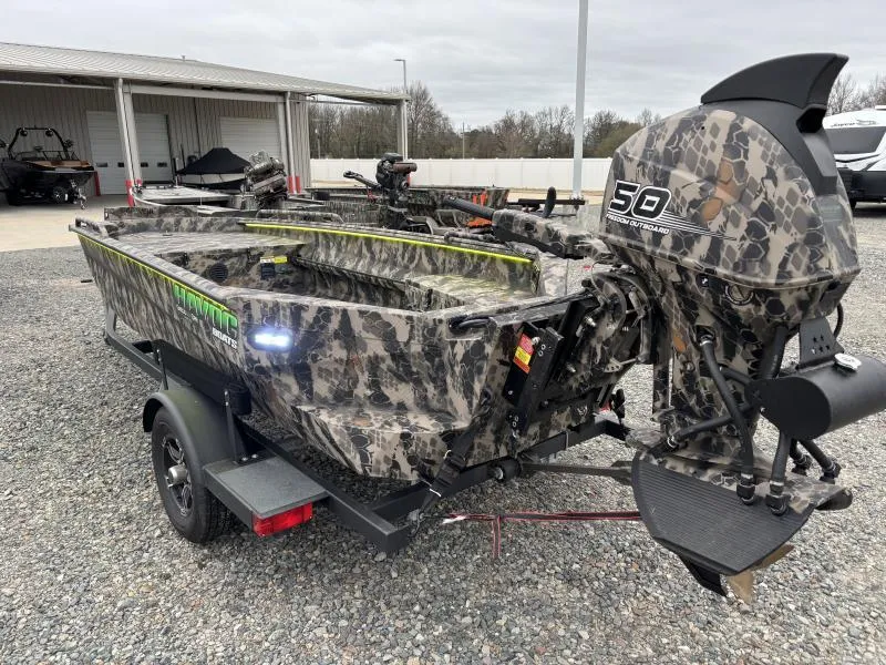 Slide: The Image of 2024 Havoc Boats 1653 MSTC with camouflage design and powerful outboard motor. - 6