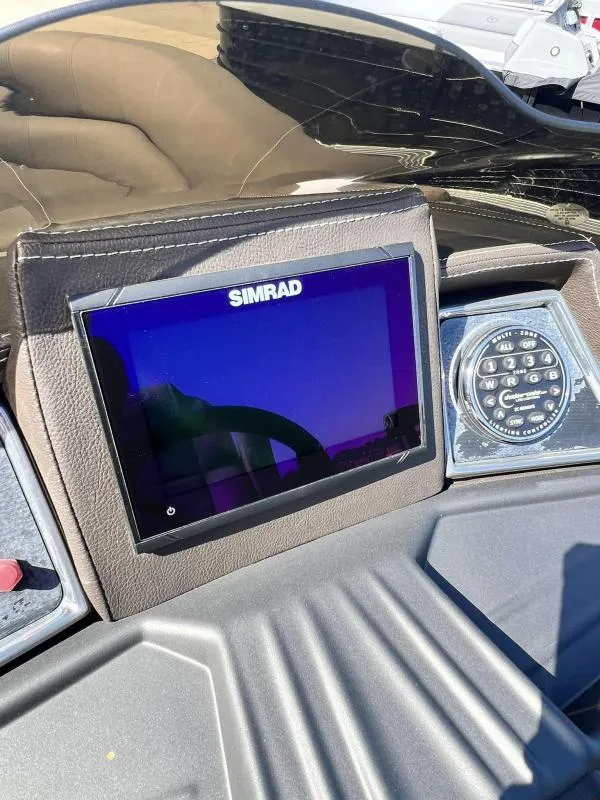 Slide: The Image of 2024 Veranda VTX25RC dashboard with Simrad display and control panel. - 15