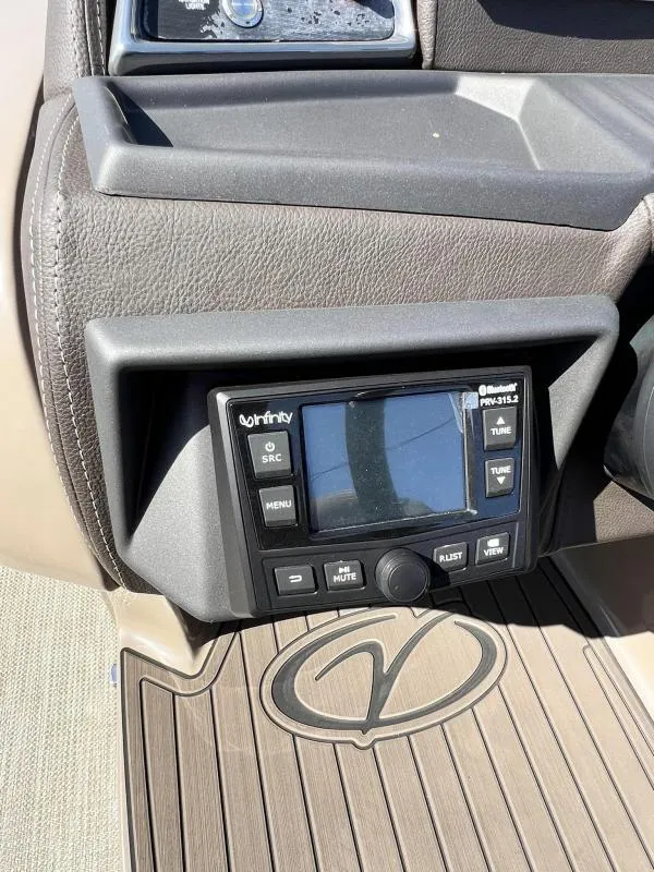 Slide: The Image of 2024 Veranda VTX25RC dashboard with Infinity stereo system. - 16