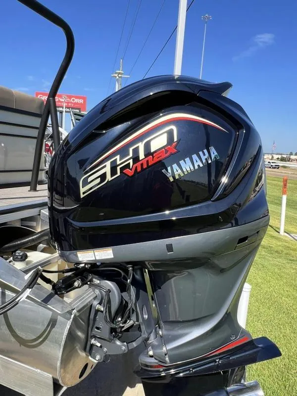 Slide: The Image of 2024 Veranda VTX25RC with Yamaha SHO VMAX outboard motor, parked on grass. - 7