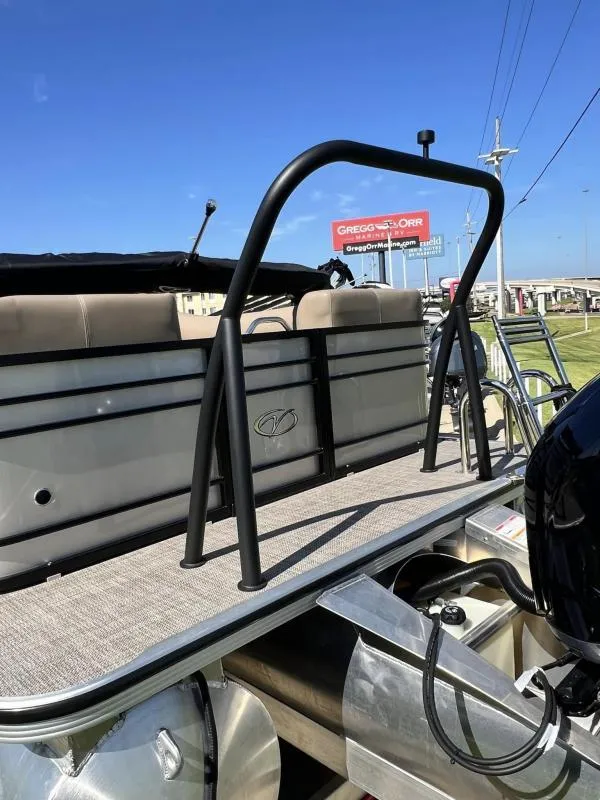 Slide: The Image of 2024 Veranda VTX25RC pontoon boat with railing, displayed outdoors. - 8