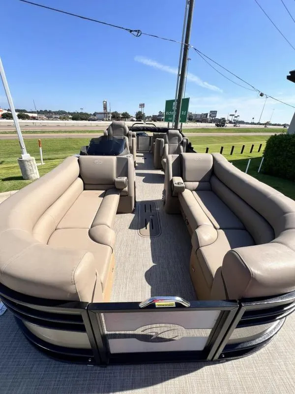 Slide: The Image of 2024 Veranda VTX25RC pontoon boat with spacious seating and modern design. - 9