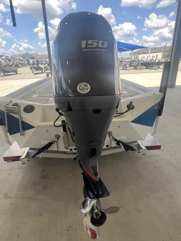 Slide: The Image of 2023 Excel Boats 220 Bay Pro with 150 horsepower outboard motor, rear view. - 14