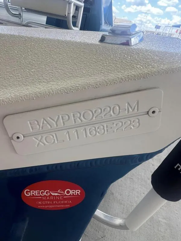 Slide: The Image of 2023 Excel Boats 220 Bay Pro with identification plate, Gregg Orr Marine sticker. - 15