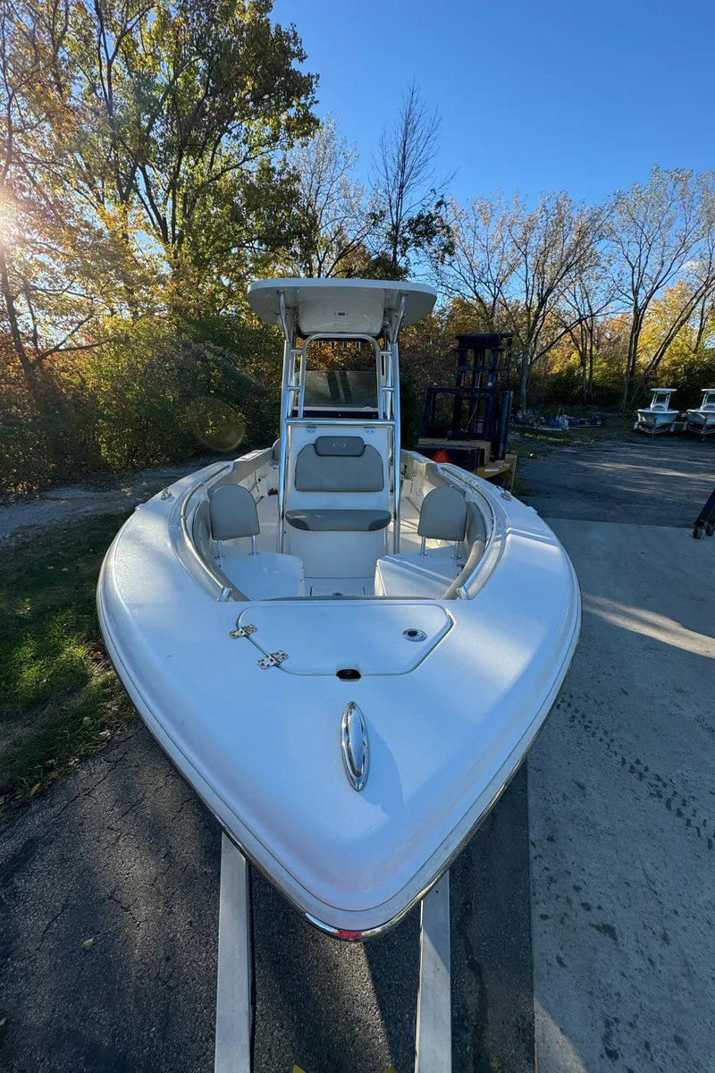 Slide: The Image of 2022 Key West 239 FS boat parked outdoors on a sunny day. - 2