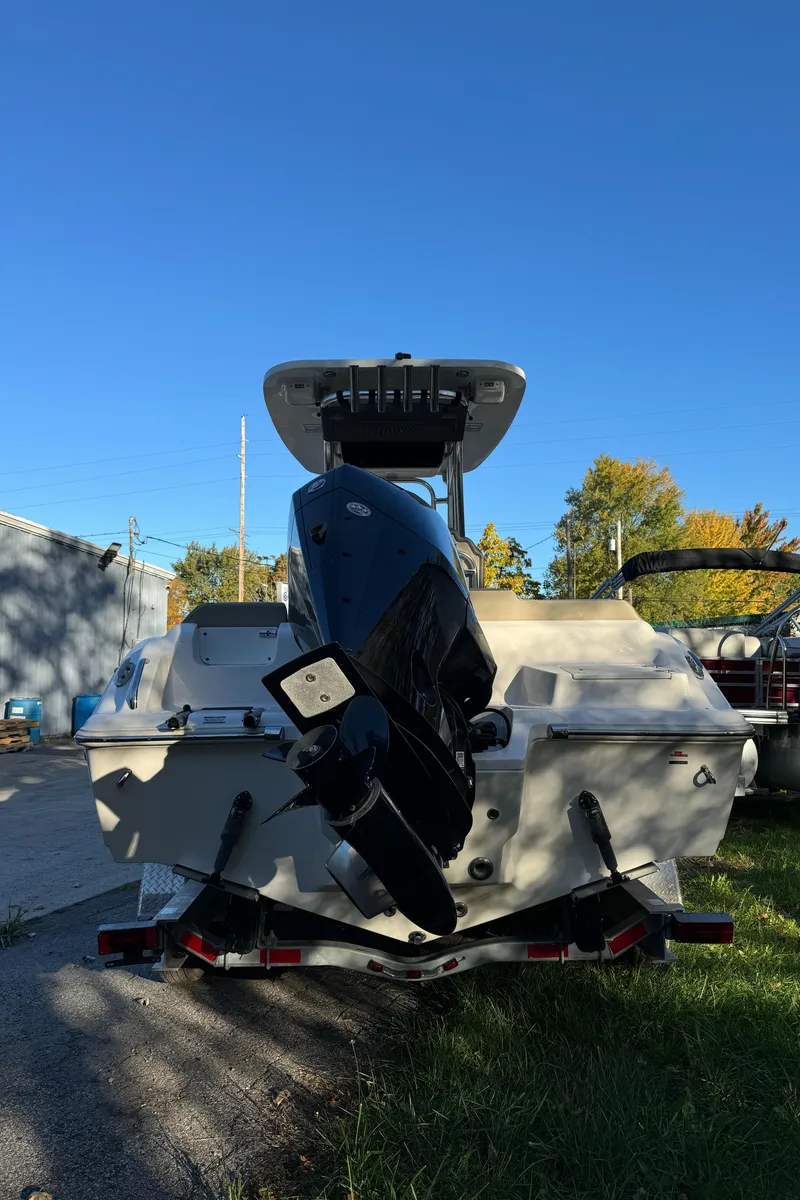 Slide: The Image of 2022 Key West 239 FS boat with outboard motor, parked on a trailer. - 5