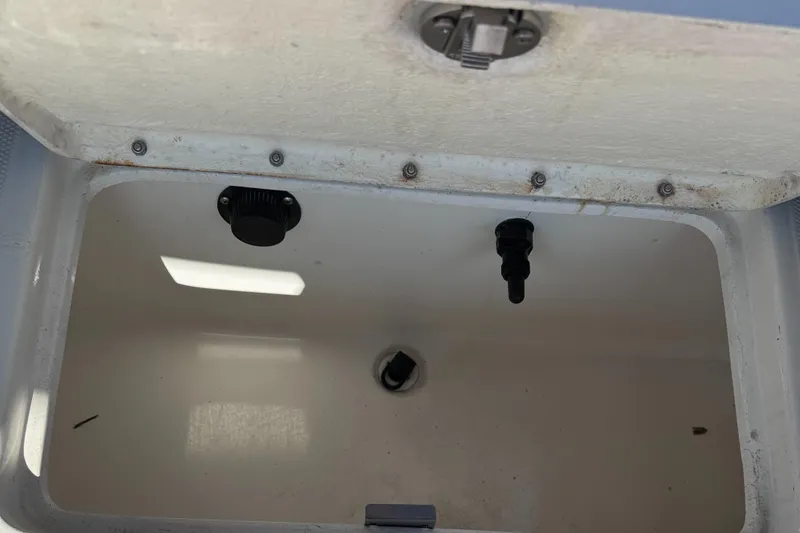 Slide: The Image of Open storage compartment in 2023 Bayliner DX2000 boat. - 15
