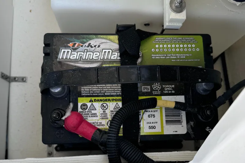 Slide: The Image of Marine battery in a 2023 Bayliner DX2000 boat. - 17