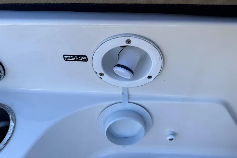 Slide: The Image of 2023 Bayliner DX2000 fresh water inlet on boat deck. - 18