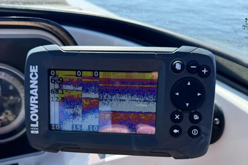 Slide: The Image of Lowrance fish finder on 2023 Bayliner DX2000 boat dashboard, displaying sonar data. - 9