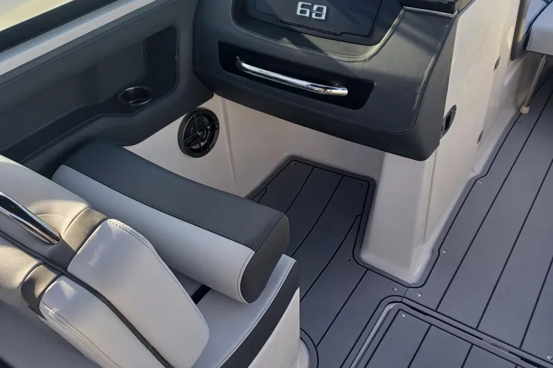 Slide: The Image of 2025 Chaparral 247 SSX interior with modern seating and sleek dashboard design. - 30